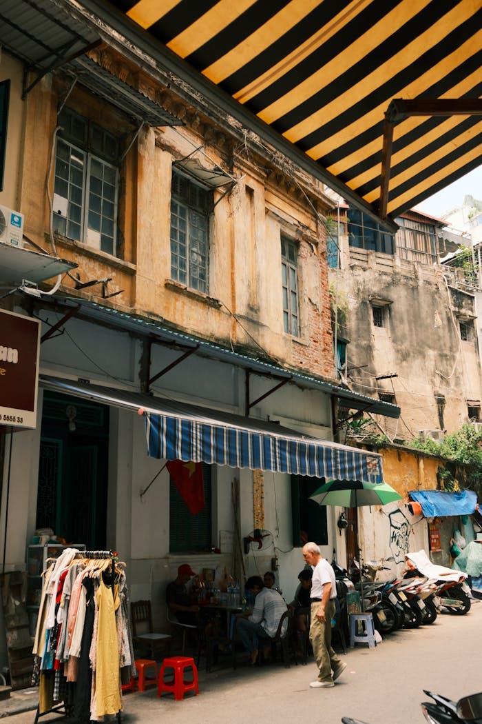 A vibrant street market in Hong Kong with vintage architecture and local life.